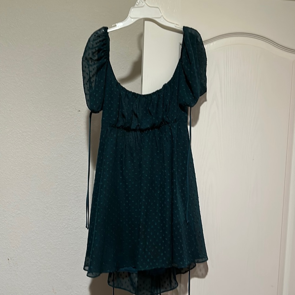 Green polka dot dress with tie in back and shoulders
